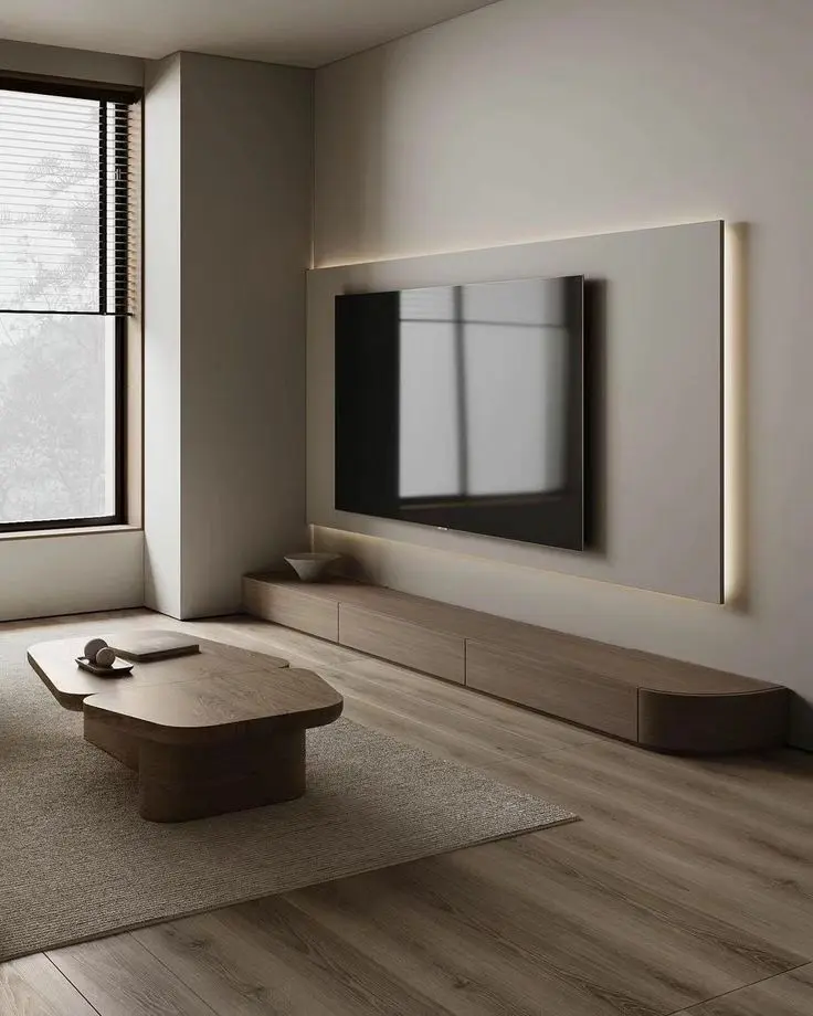 A modern kitchen with a white island, a wooden stool and a plant in a vase, interior by Archnine Design Studio
