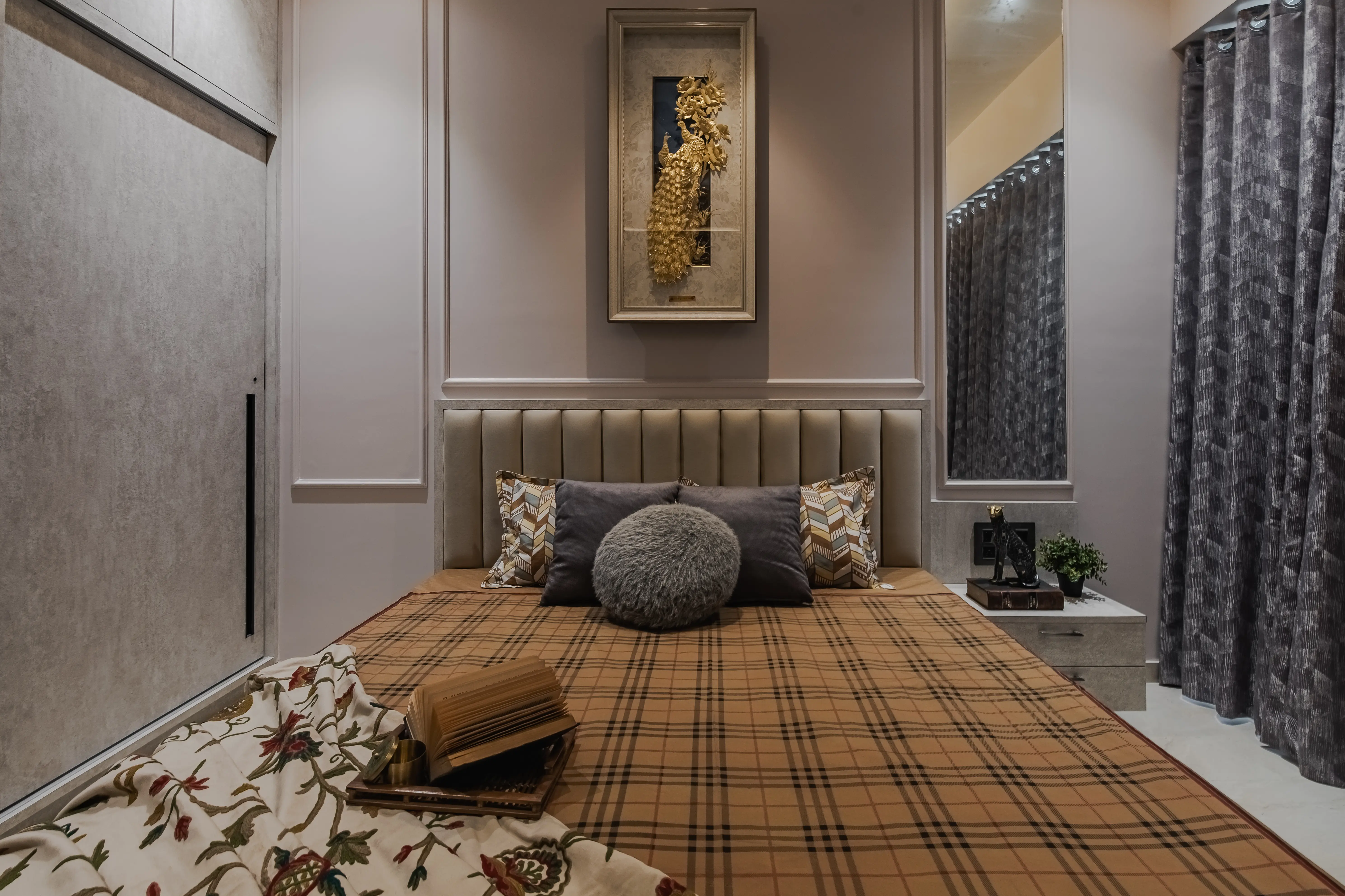 Simple bedroom features a platform bed with a painting above the headboard, interior by Archnine Design Studio