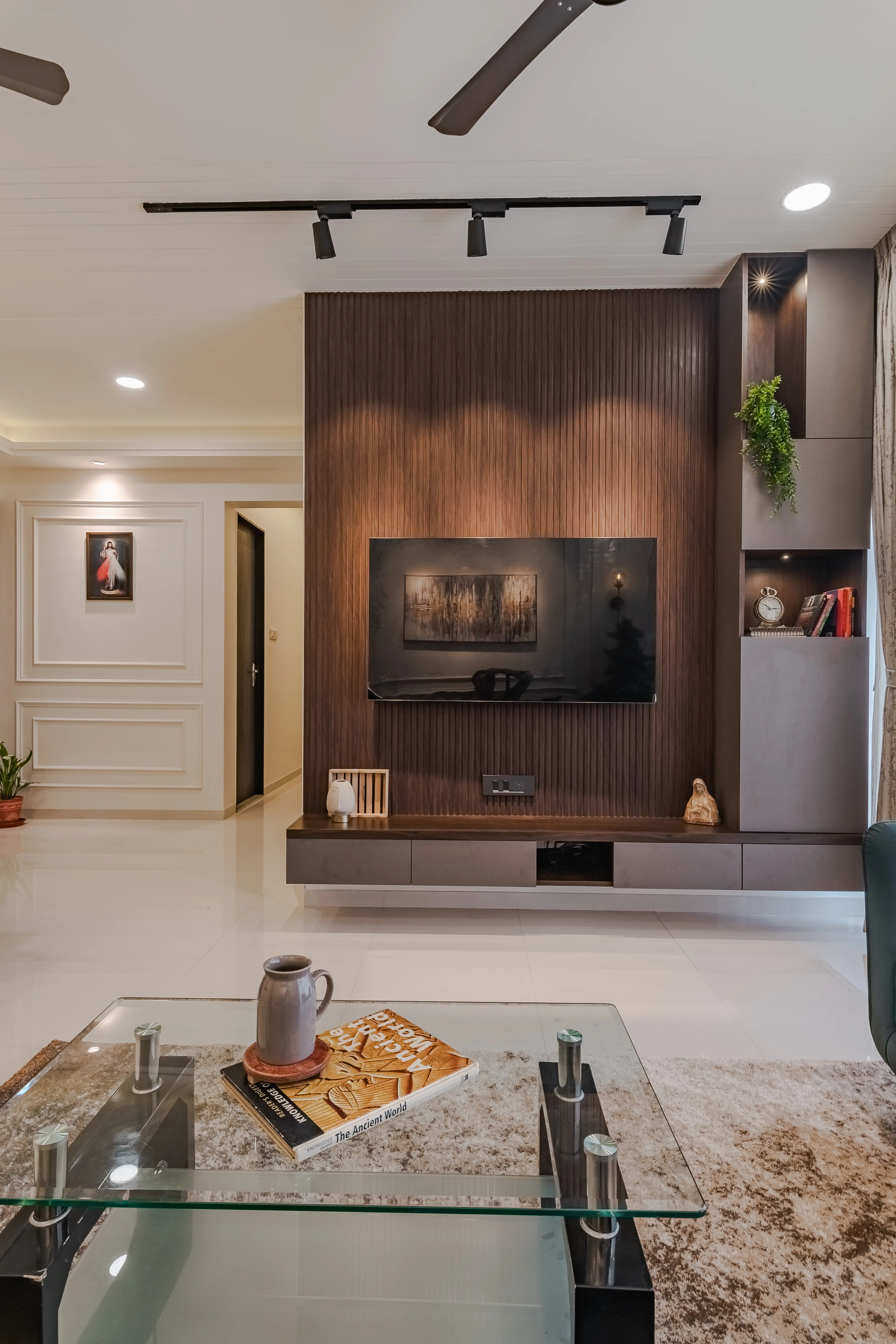 A modern living room with a sofa, a glass coffee table, interior by Archnine Design Studio